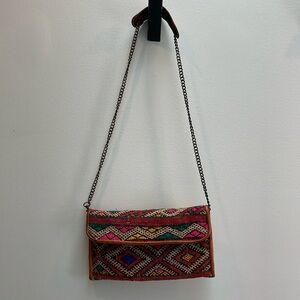 Handmade using recycled material, purchased from an art market